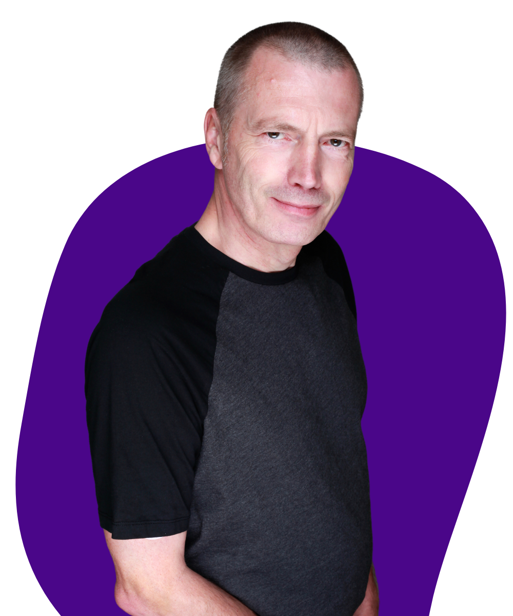 Profile Pic of Jonathan Pagden smiling to camera on a purple background